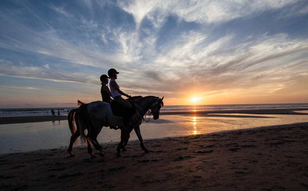 Sunset horseback ride on the beach